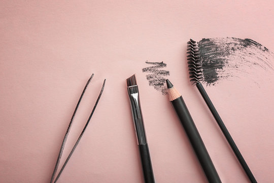 Fototapeta Tools for eyebrow dyeing and correction on color background