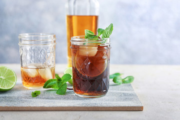 Composition with Cuba Libre cocktail on table