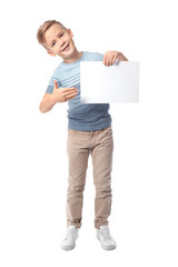 Cute boy with blank sheet of paper for advertising on white background
