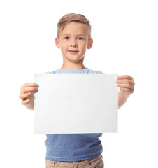 Cute boy with blank sheet of paper for advertising on white background