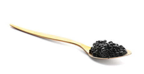 Black caviar in spoon on white background