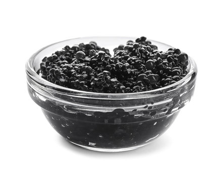 Black caviar in glass bowl on white background