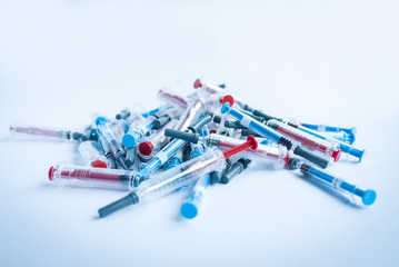 Pile of used syringes, everyday injections of insulin and heparin