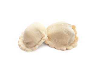 Raw dumplings on white background