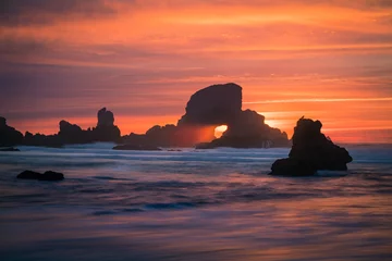 Fotobehang Kust Sunset behind arch at Oregon coast USA  © FreebillyPhotography