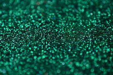 A huge amount of green decorative sequins. Background texture with shiny, small elements that...
