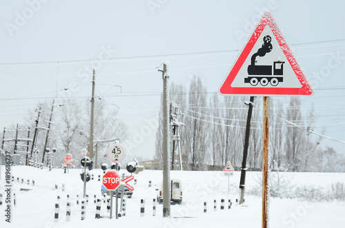 Railway Crossing Without A Barrier With A Lot Of Warning Signs In The Snowy Winter Season Wall Mural Mehaniq41 Railway Crossing Without A Barrier With A Lot Of Warning Signs In The Snowy Winter Season Wall Mural Mehaniq41
