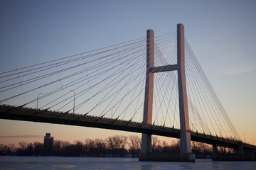 A bridge and frozen river in the morning