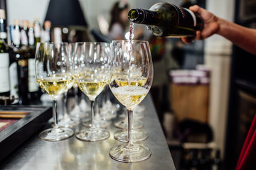 waiter brings glasses of champagne