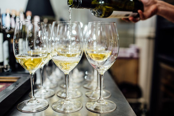 waiter brings glasses of champagne