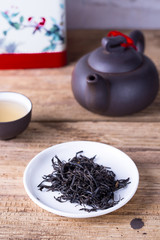 Loose tea on a white plate. Gong fu tea ceremony tea ware. 
