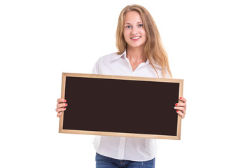 Naklejka premium Beautiful caucasian woman in white shirt and holding blank blackboard. Studio shooting isolated on white