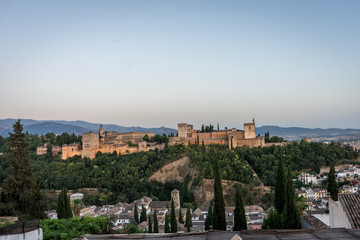 Fototapeta premium The magnificient Alhambra of Granada, Spain. Alhambra fortress at sunset viewed from Mirador de San Nicolas