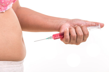 Fat woman holding syringe and inject red medicine to her belly isolated on white
