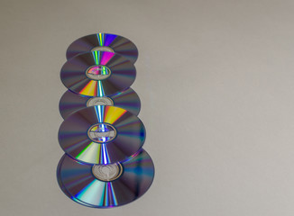 A set of compact disks lying horizontally