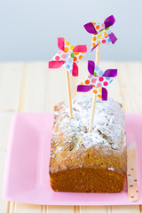 Sugar dusted pound cake with pinwheel cake toppers 