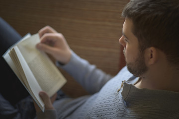 Fototapeta na wymiar Young man enjoying a great book