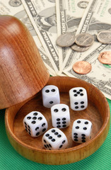 Five dice with a wood dice cup