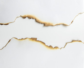Close up paper burns edge with shadow on a white backgrounds use for design or wallpaper