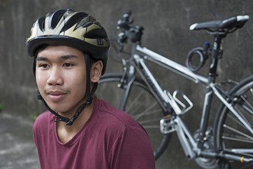 Obraz na płótnie Canvas Teenager In Bicycle Helmet