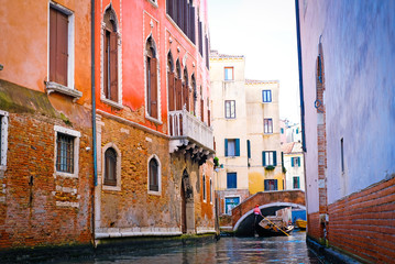Canal with traditional gondolas in Venice,Italy