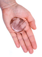 Polished quartz flat palm stone with red hematite inclusions from Madagascar