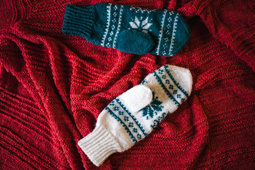 Two knitted mittens.