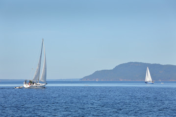 Fototapeta na wymiar Gulf Islands Sailing, British Columbia. Sailboats on a sunny day in the Gulf Islands, British Columbia.