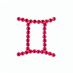 Gemini. Sign of the zodiac of red rhinestones on a white background.