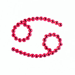 Cancer. Sign of the zodiac of red rhinestones on a white background.