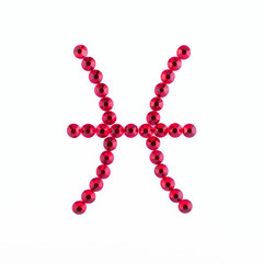 Pisces. Sign of the zodiac of red rhinestones on a white background.