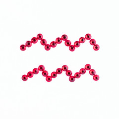 Aquarius. Sign of the zodiac of red rhinestones on a white background.