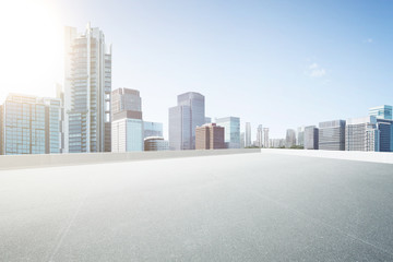 Empty space top floor car park with modern skyscraper building .