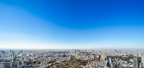 Asia Business concept for real estate and corporate construction - panoramic modern city skyline bird eye aerial view of Shinjuku & Shibuya under blue sky in Roppongi Hill, Tokyo, Japan