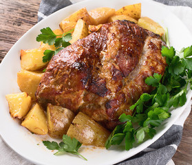 Roasted pork with potatoes.