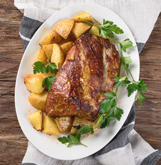 Roasted pork with potatoes.