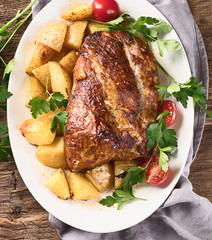 Roasted pork with potatoes.