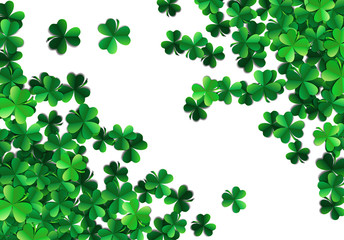 Saint Patricks day background with sprayed green clover leaves or shamrocks