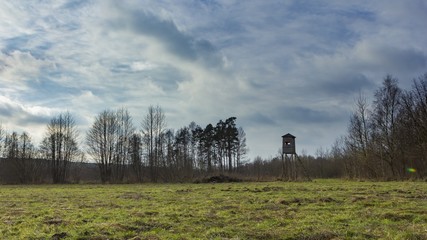 Meadow landscape with raised hide