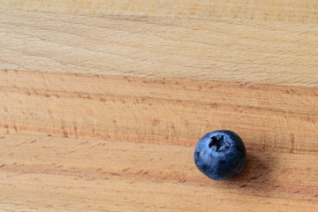 Whortleberry on wooden background