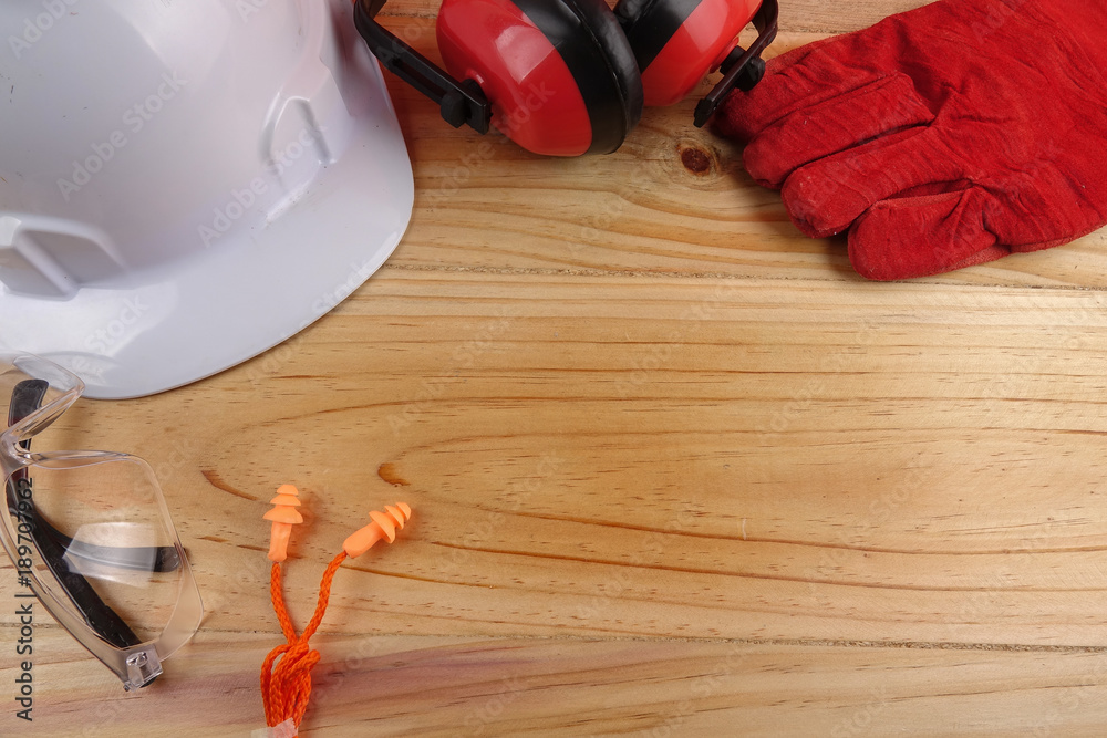 Wall mural health and safety concept. personal protective equipment on wooden table background. copy space