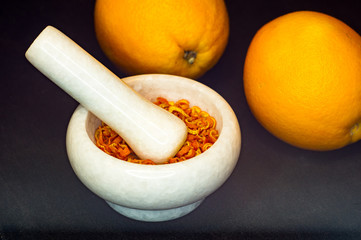 White marble mortar with the orange zest