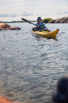 Senior Mature Woman Sea Kayaking