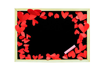 red paper shaped heart around blackboard on white isolated background