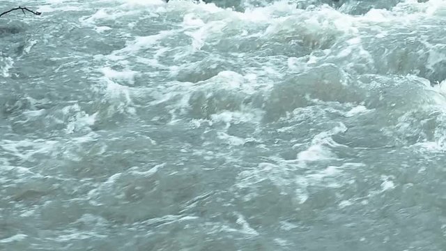 Blue river in slow motion footage.