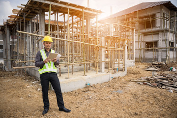 construction engineer worker using tablet computer at building site