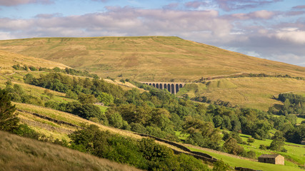 The Dent Head Viaduct on the Settle-Carlisle Railway, seen from Cowgill in the Yorkshire Dales, North Yorkshire, UK
