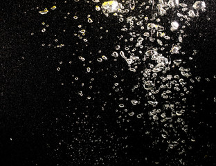 bubbles with air in water on a black background