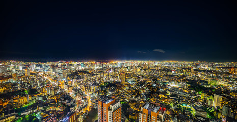 Asia Business concept for real estate & corporate construction - panoramic modern city skyline view of Tokyo Metropolitan Expressway with neon night in Roppongi Hill, Tokyo, Japan