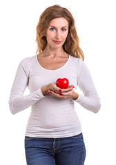 Love heart, protect and healthcare concept : Caucasian woman holding red heart on her chest and heart position isolated on white